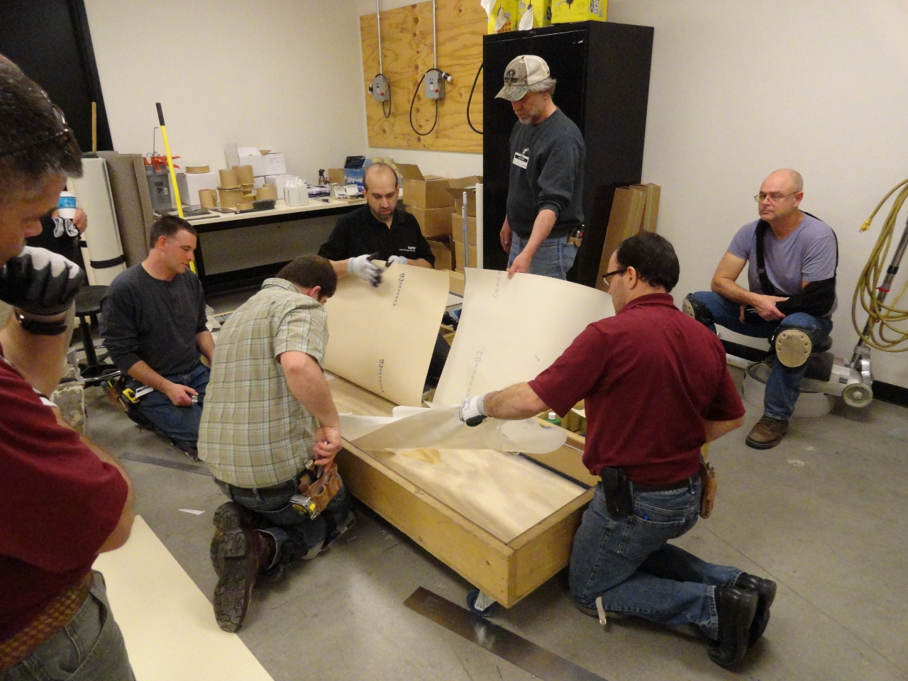 Technical Academy instructor Marc Ilgenfritz, center facing, invites installers 