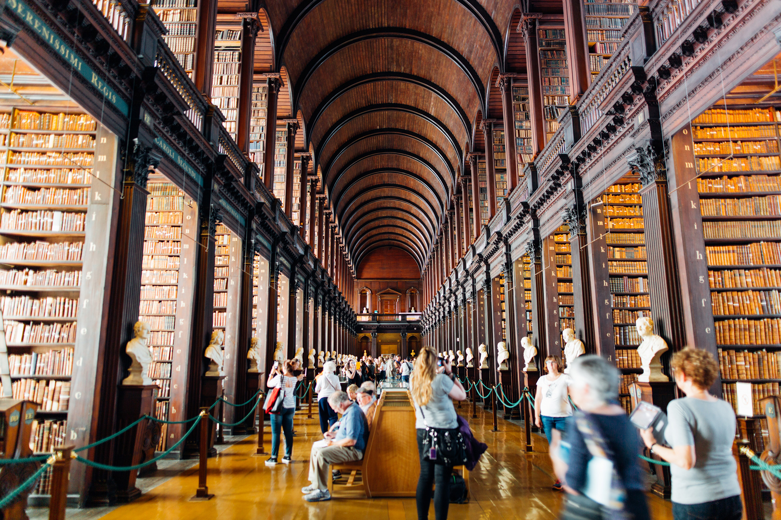 People inside historic library building