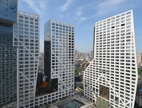 Sliced Porosity Block combines concrete and glass towers with public plazas.