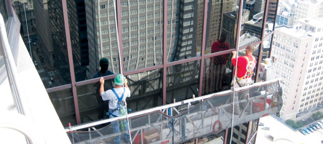 Workers repair a failed glass curtain wall. As glazed curtain walls age, many o