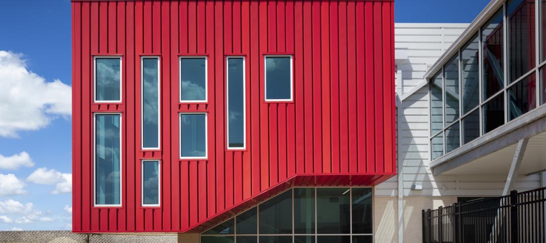 PAC-CLAD Highline S1 metal wall panel system clads Del Valle Career & Tech Center in 3 shades of red