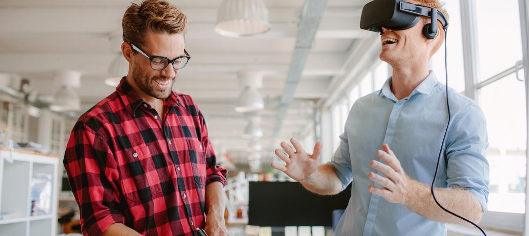 Two businessmen testing virtual reality headset