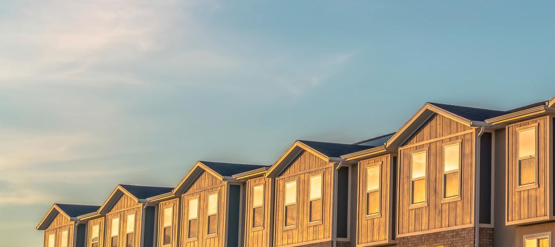 Panorama Exterior of single-family rentals with wood and brick wall sections and sliding windows