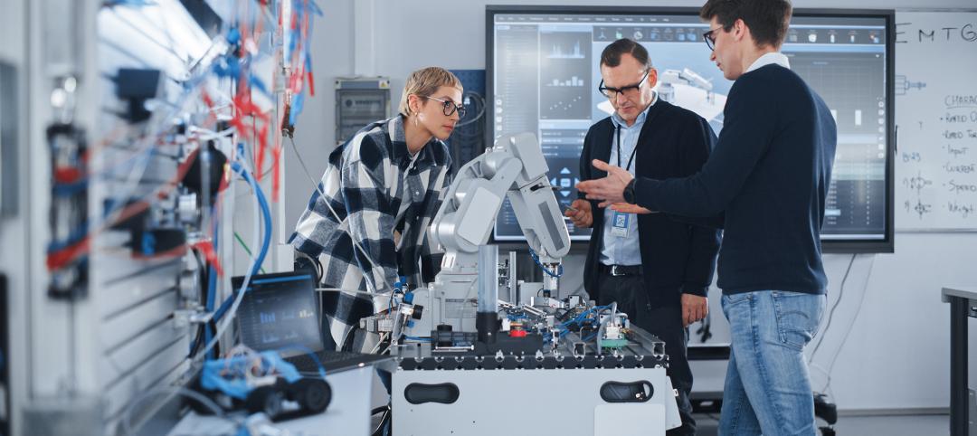 People Discussing Robotic Prototype of Hand. Computer Science Education Concept