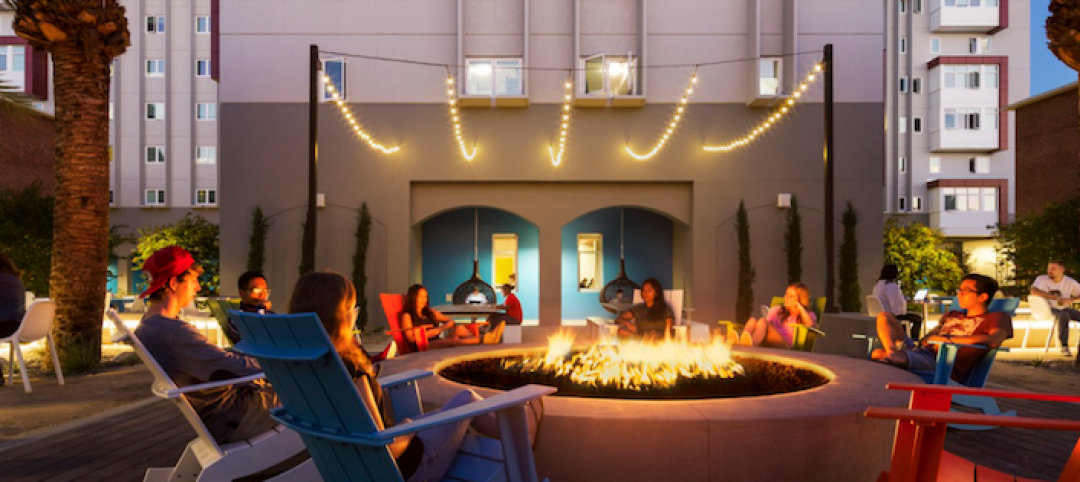 Students sit around a fire at a campus student center