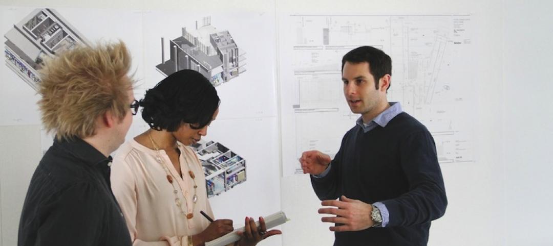 Jared Krieger (right) conducts a project coordination meeting with two of his Ge