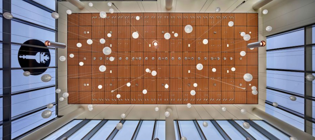 Lighting hanging from a double-height lobby space in the Rohrer College of Business facility