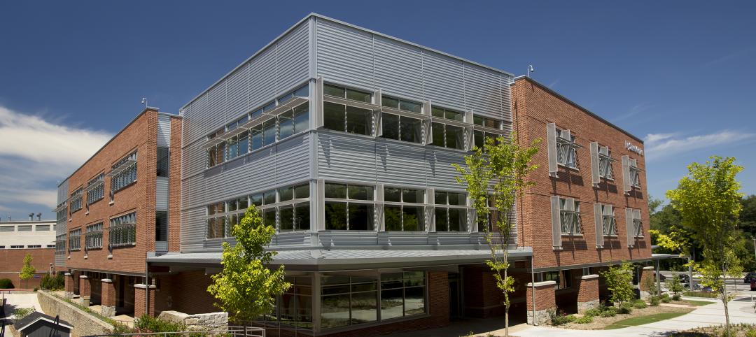 Metal wall panels’ deep shadow lines break up massing of Georgia school