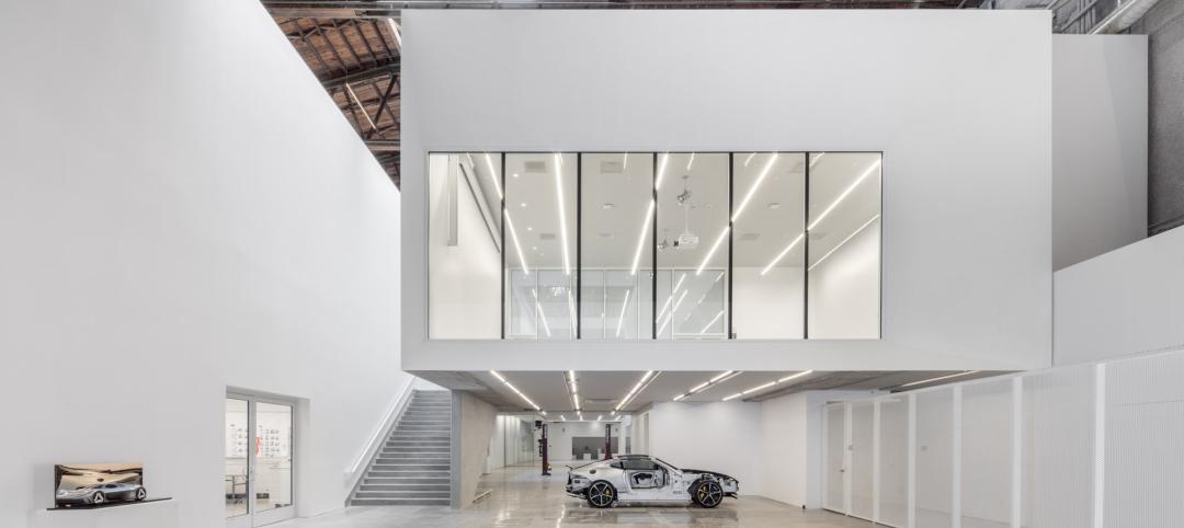 This image from the Fabrication Lab on level one features a “cut away” Jaguar F-Type and shows the hovering flexible lecture / gallery space above. Photo: Joshua White