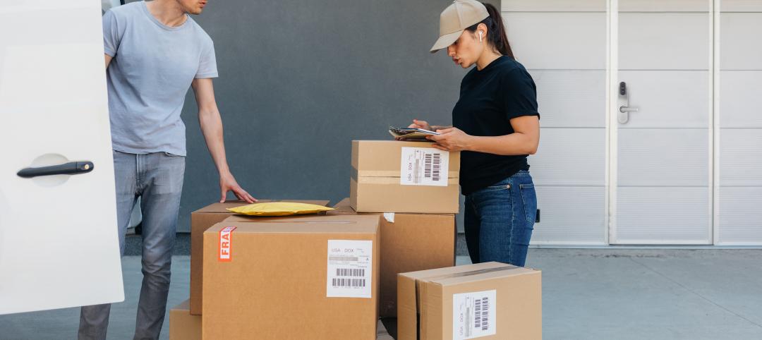 Man and woman with a lot of boxes, open van door