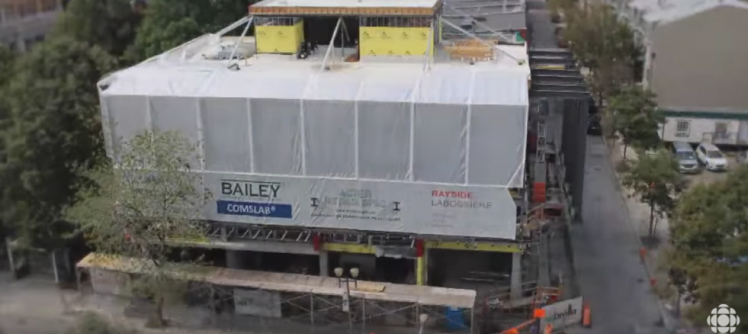 Multifamily building in downtown Montreal is being built from the roof down