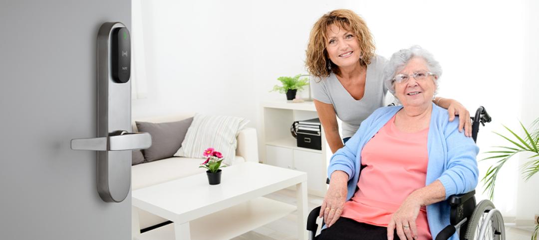 Senior woman with a nurse. The door is open to her room, displaying the SALTO smart lock