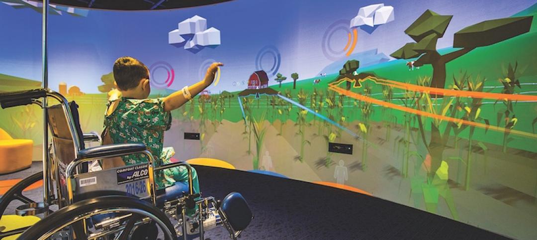 A child uses the Nick's Theater in the Gerdin Family lobby at the Stead Family Children's Hospital