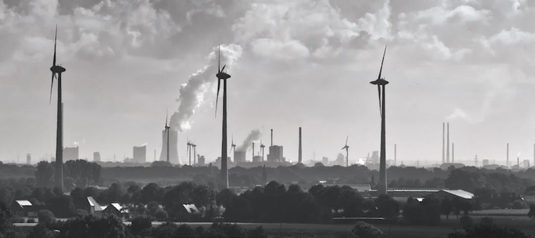 Wind turbines and smokestacks 