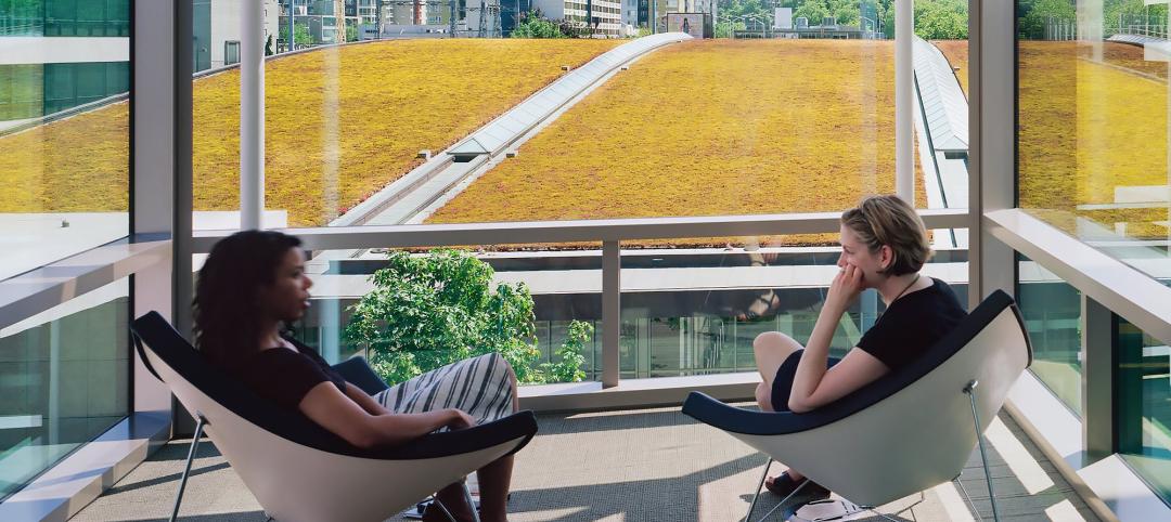 Two people sitting in comfortable chairs in front of window