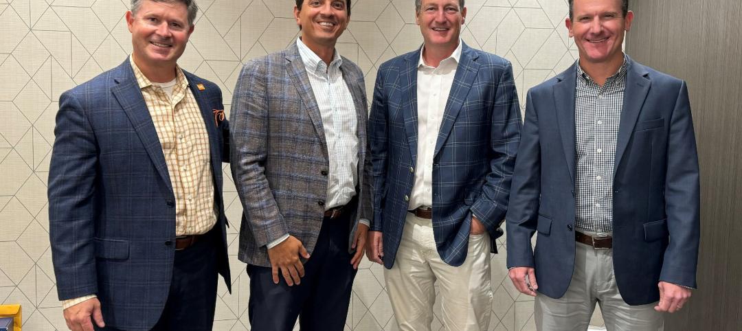 Businessmen in suits standing for photo