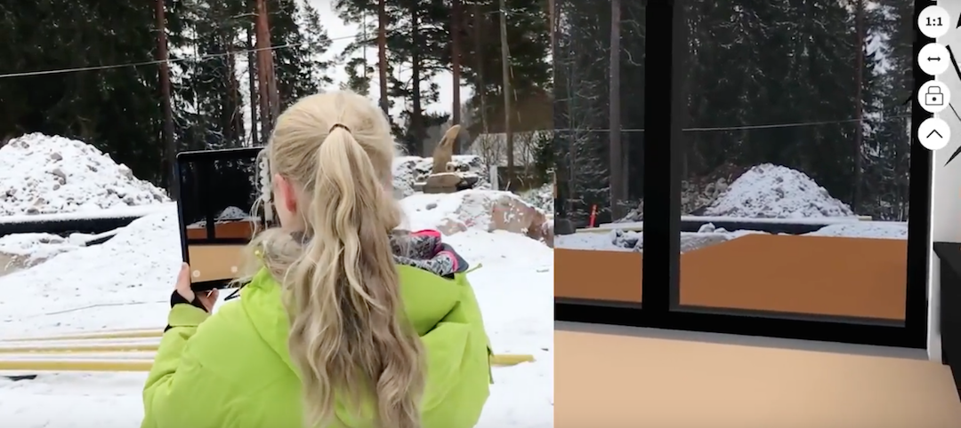 Woman using a tablet to view an unbuilt project on a jobsite