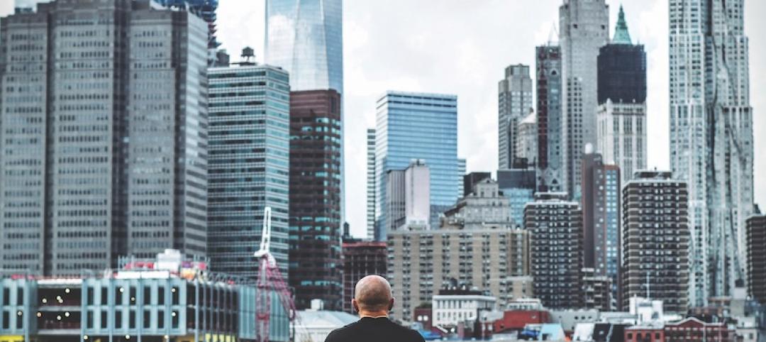 A man standing in front of the New York City skyline