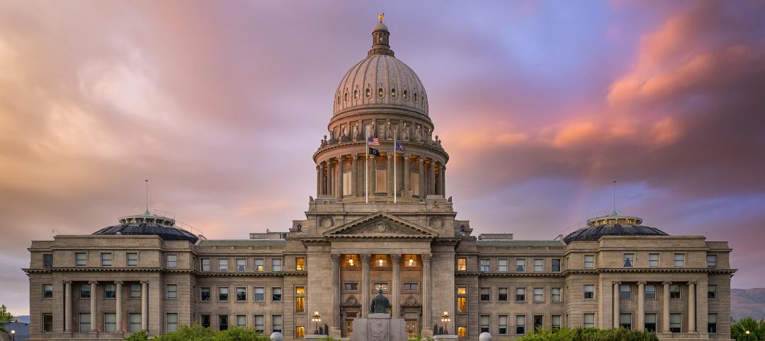 Facade of aged historic cathedral under colorful sky at sunset