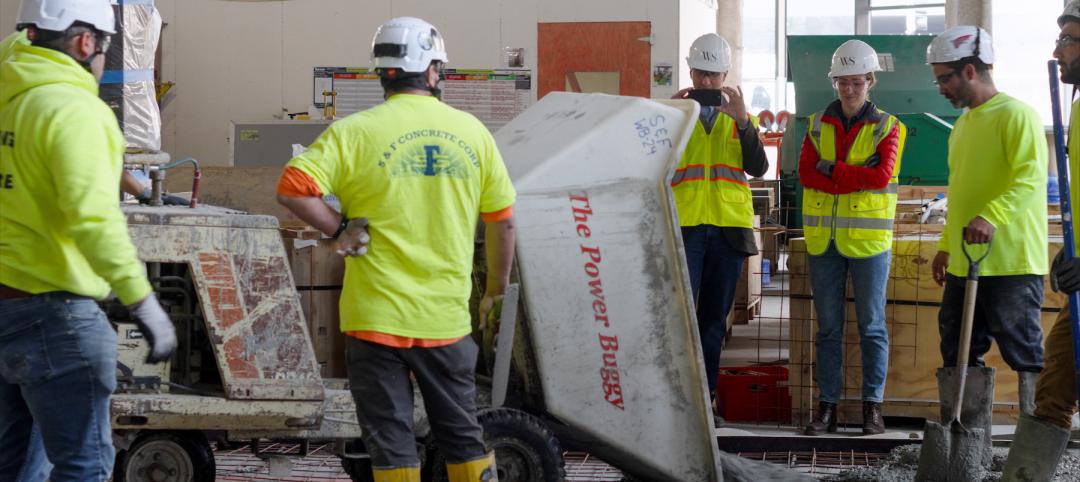 Crews pouring concrete produced with low-carbon technology