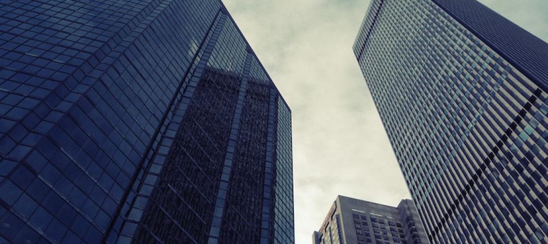 Three high-rise buildings as seen from the ground