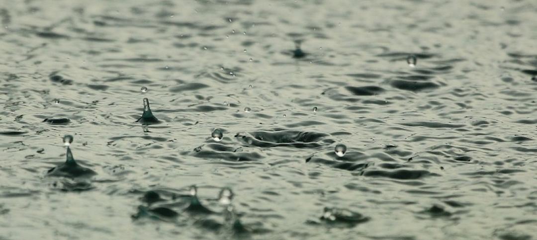 Rain falling into a puddle