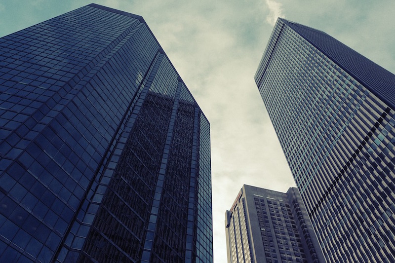 Three high-rise buildings as seen from the ground